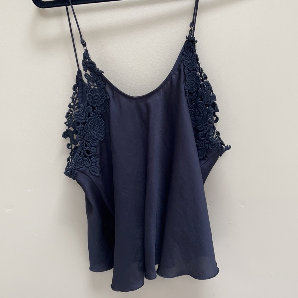 Free People flowy black top with lace detail